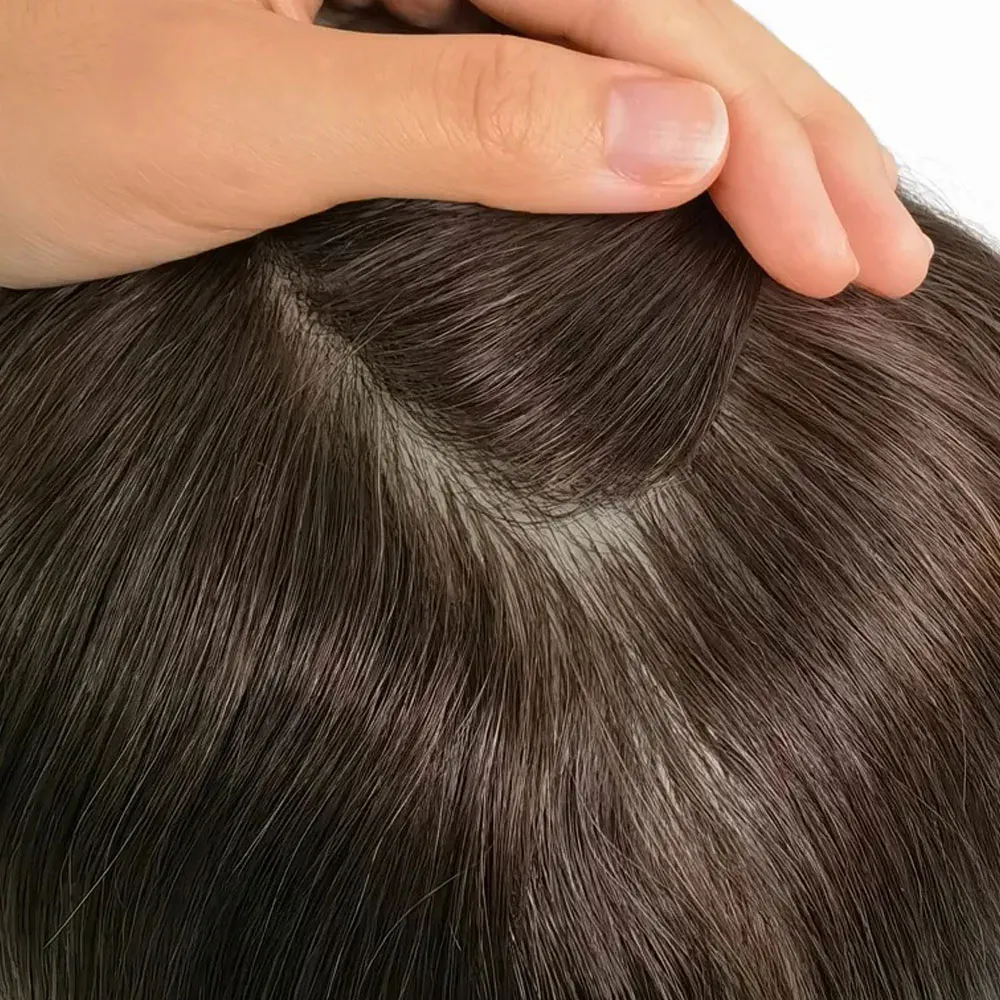 Close up of knotless full injection skin base on getmehair toupee showing hair growing directly from scalp